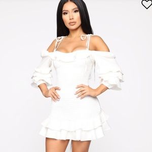 Off shoulder white mini dress.